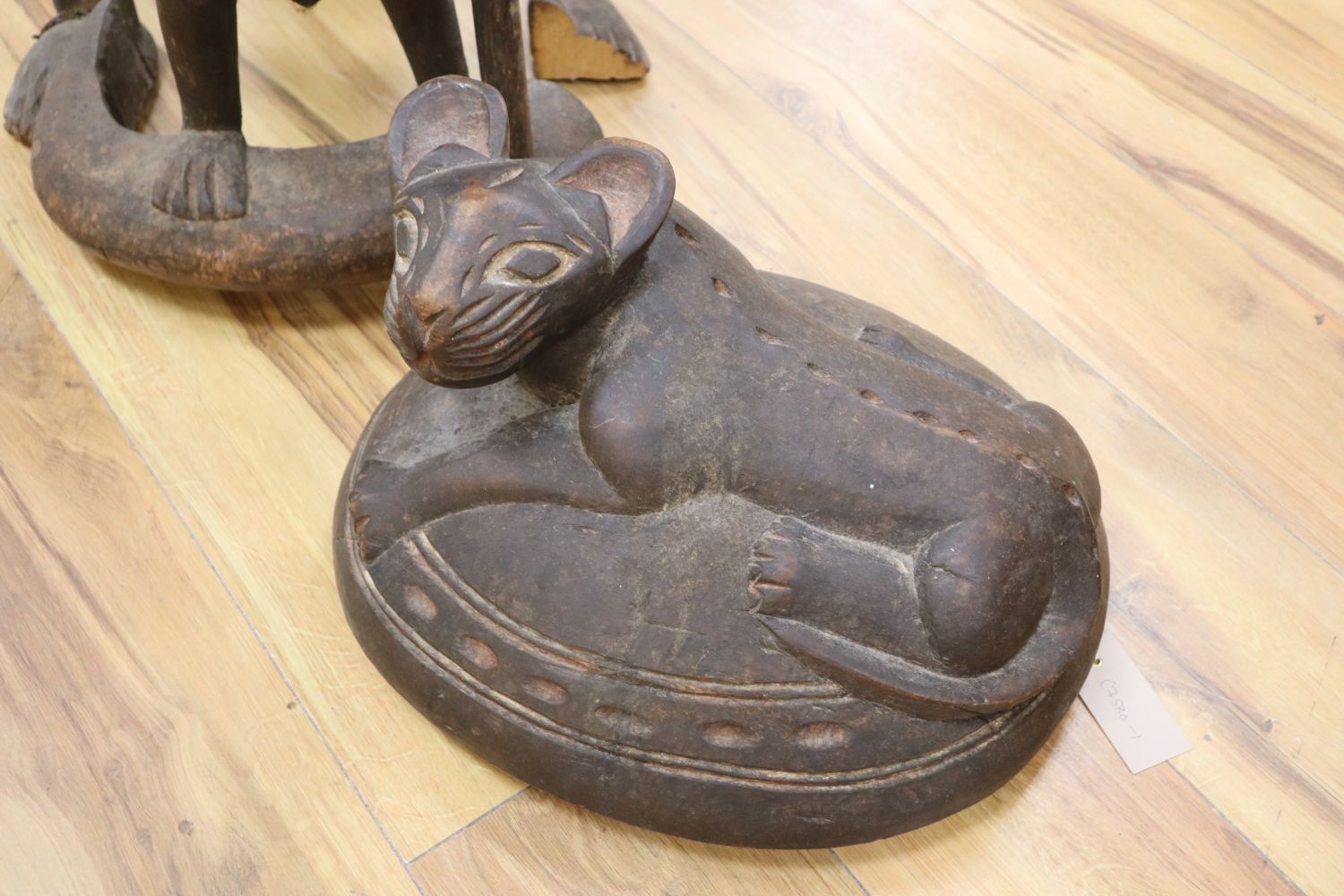 A large Bamileke carved wood figural storage vessel, Cameroon, length 109cm